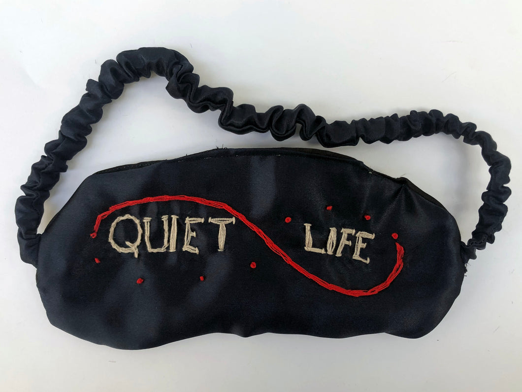 Hand-sewn and embroidered 'Quiet Life' sleep mask in dark blue silk satin