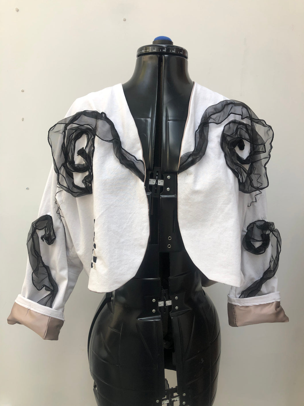 Hand-made white cotton bolero jacket embroidered and embellished.